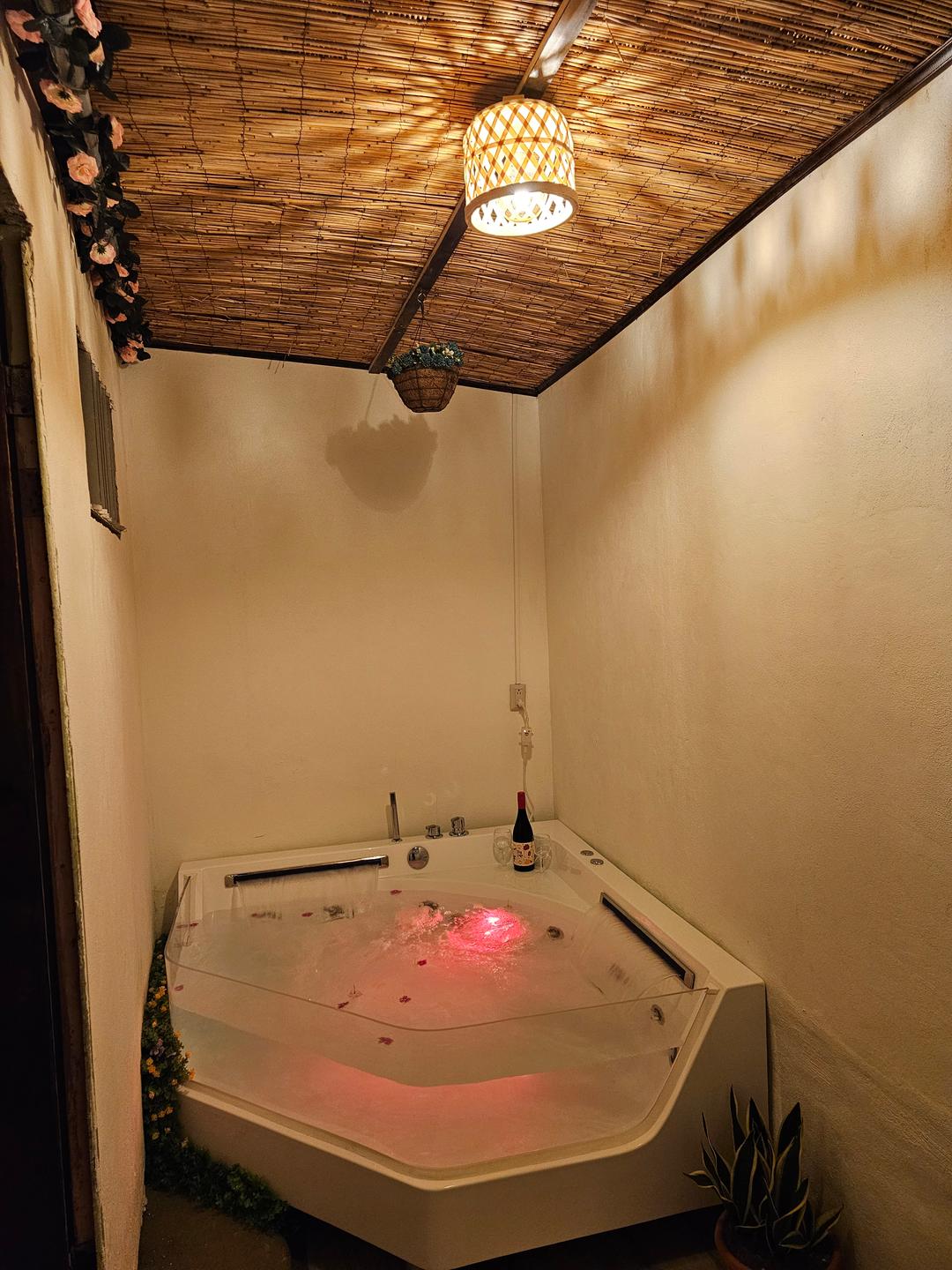 Spacious matrimonial bed in the living room of Guayabón Cabin 3, La Fortuna