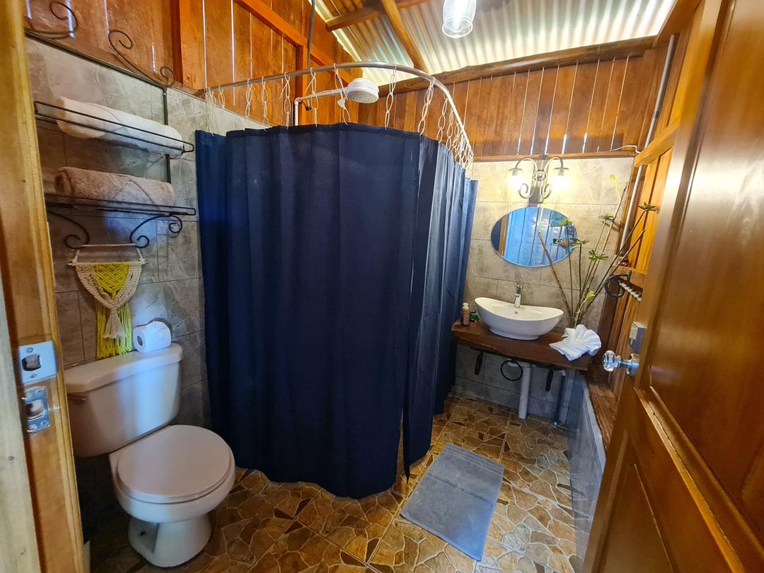 Cabin Eco Container Charming outdoor sitting area of eco-container cabin in the heart of La Fortuna.