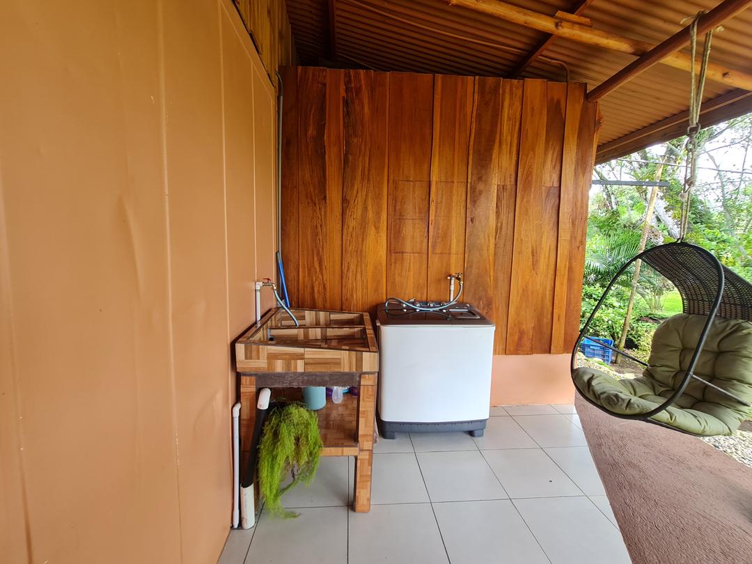 Cabin Eco Container Welcoming front porch of eco-container cabin with lush plant decorations in La Fortuna.